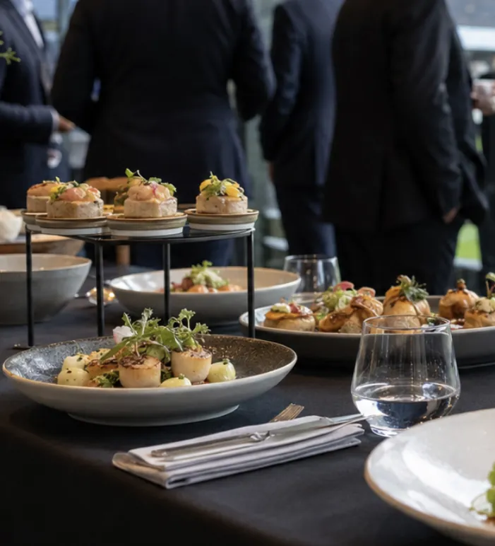 Canapes and small plates laid out for a drinks reception catered by Domu