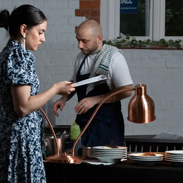 Seyj and the Domu chefs working the pass during service