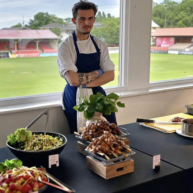 Domu chef with a live grill and salad station at an event